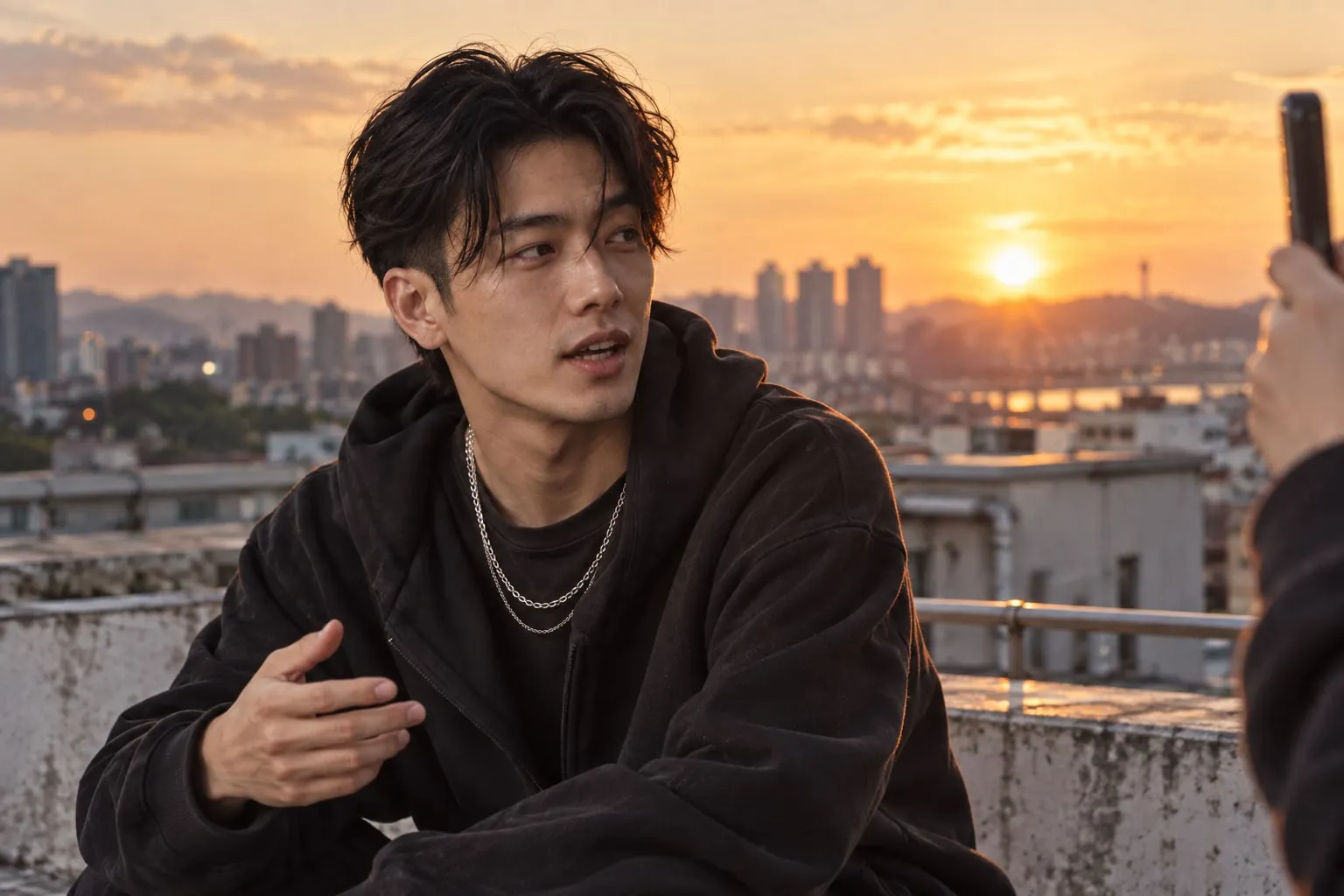 A creator being filmed on a rooftop at golden hour